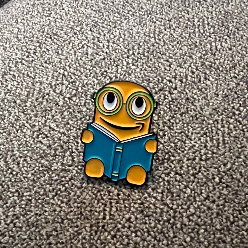 Amazon Peccy reading Enamel Pin with Teal Book